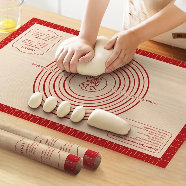 Rolling dough on silicone mat with measurement grid